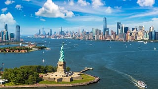 getty statue of liberty and new york city harbor aerial photo.jpg