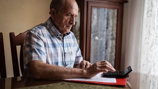 older man calculator gettyimages .jpg