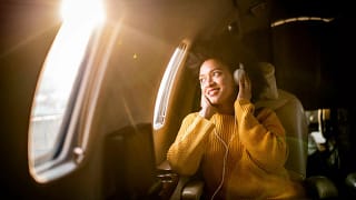 Airplane passenger listening to music olkY.width .jpg