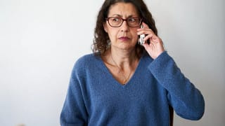 confused person using cell phone.jpg