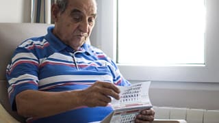 older person looking at a calendar.jpg
