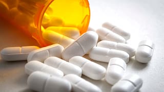 open pill bottle spilling out.jpg