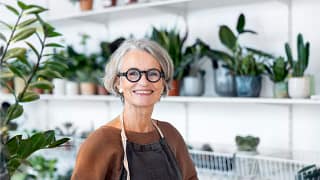 person smiling in a flower shop.jpg