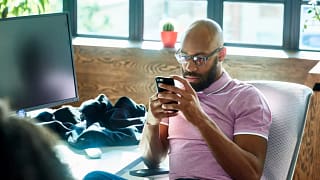 Man looking at phone contemplative QBnEzD.width .jpg