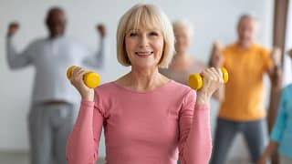 getty smiling with weights exercise fitness workout.jpg