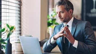 man biz suit laptop serious gettyimages .jpg