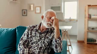 older man couch headache gettyimages .jpg
