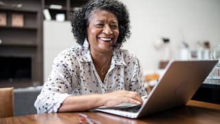 older woman laptop smiling gettyimages .jpg