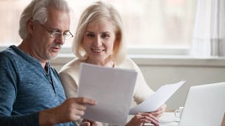 retired couple looks at papers.jpg