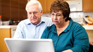 senior couple serious at laptop gettyimages .jpg