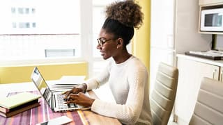 woman performs online job search from home SW.width .jpg