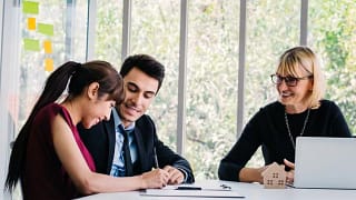 woman signing documents.width .jpg