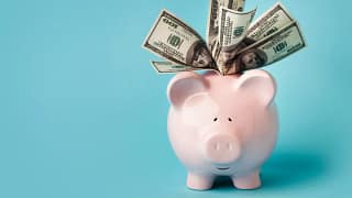 gettyimages overstuffed piggy bank.jpeg