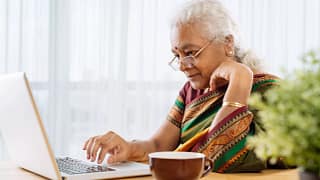 serious senior staring at laptop.jpg