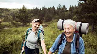 two older people outside hiking.jpg