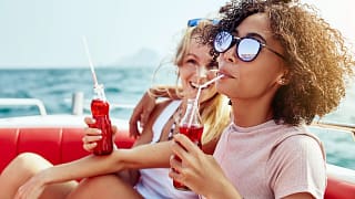 friends drinking soda on boatt.jpg
