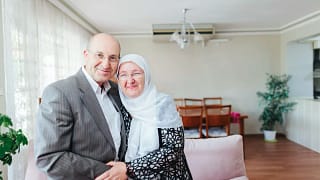 getty smiling couple on couch.jpg