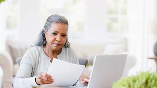 older woman document laptop.jpg