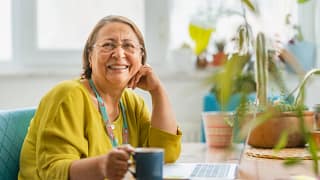 person sitting at a desk and smiling.jpg