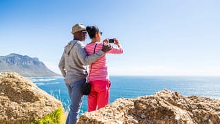senior couple taking photo of the ocean.jpg