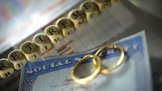 social security card with wedding rings.jpg