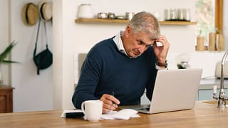 worried person looking at laptop.jpg
