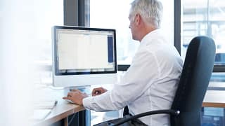 a person at a computer gettyimages .jpg
