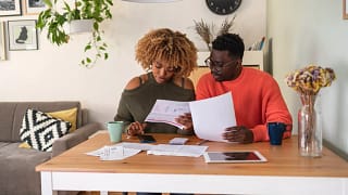 couple reviewing papers budgeting.jpg