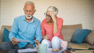 stressed couple looking at documents.jpg