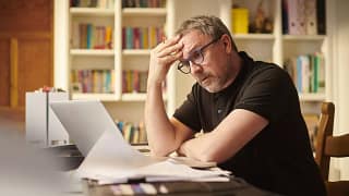 worried investor looking at computer.jpg