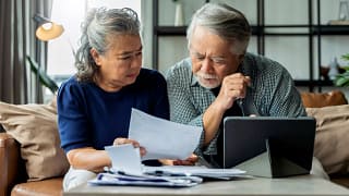 people with concerned expressions looking at document.jpg