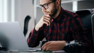 man s at desk serious gettyimages .jpg
