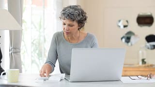 person sitting at table in front of computer.jpg