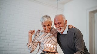 senior couple birthday cake gettyimages .jpg