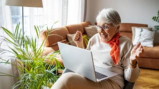 excited person looking at laptop.jpg