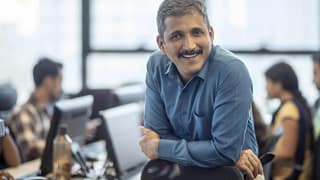getty happy smiling business person at office.jpg