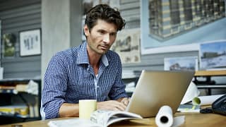man s laptop concentrating gettyimages .jpg