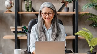 older woman laptop smiling gettyimages .jpg