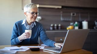 retired woman investing laptop k ira.jpg