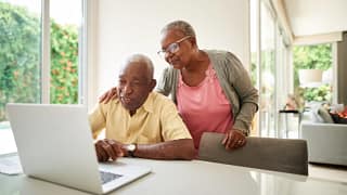 senior couple at laptop gettyimages .jpg