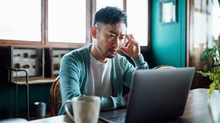 concerned unhappy person staring at laptop.jpg