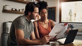 couple looking at financial papers.jpg