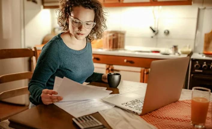woman with bills and computer.width .jpg