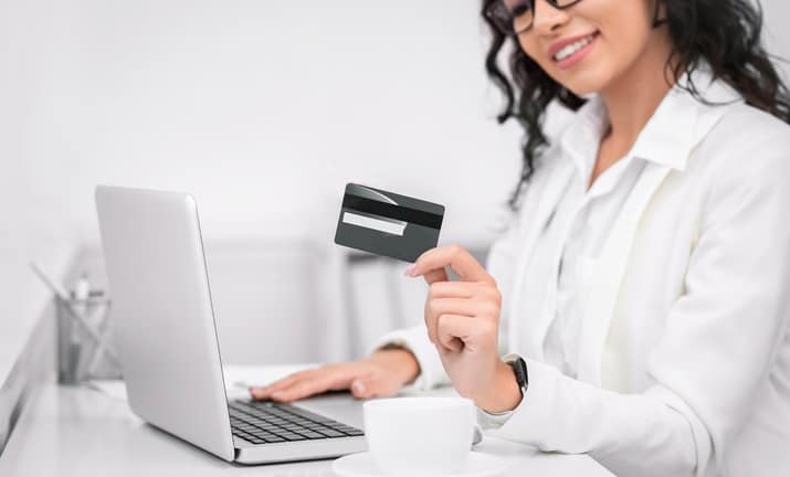 smiling woman with credit card.width .jpg