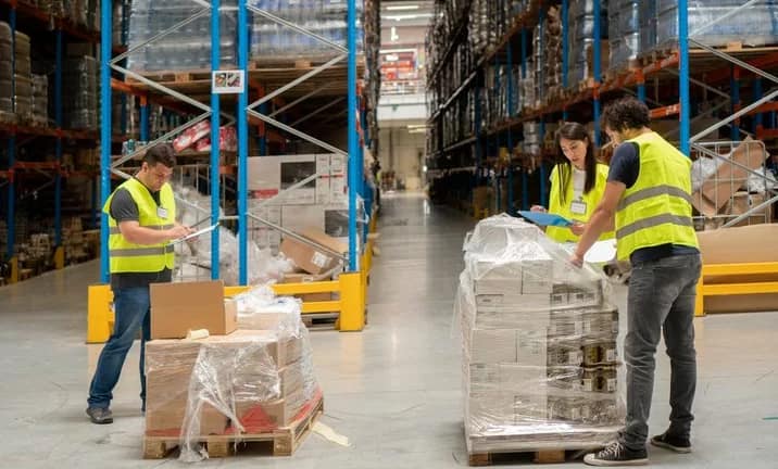 warehouse employees unpacking boxes.width .jpg