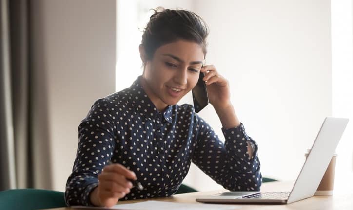 Woman with laptop on phone.width .jpg