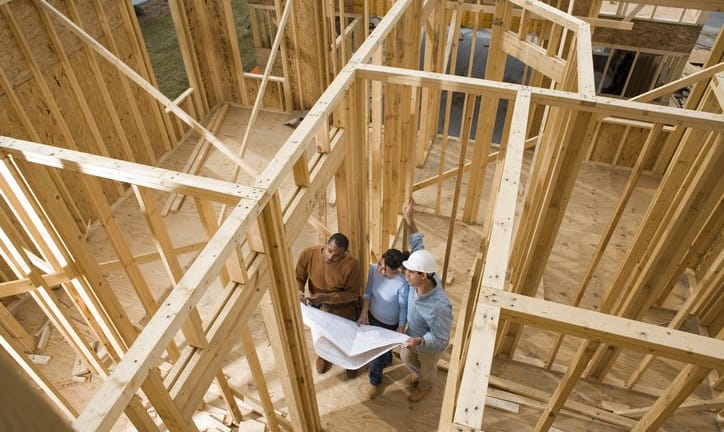 couple with architect in house under construc.width RSmacdW.jpg