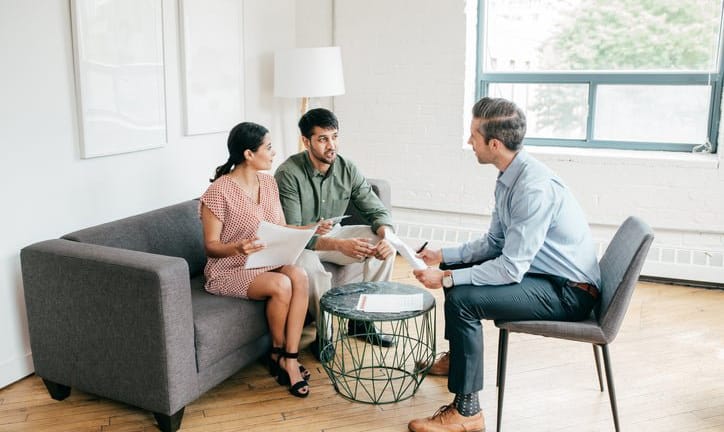couple with realtor and paperwork KsVHLK.width .jpg