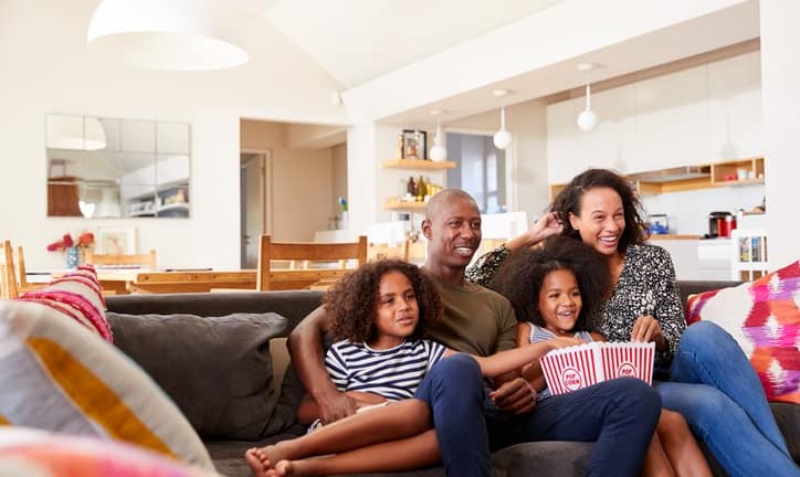 family watching movie on couch.width .jpg