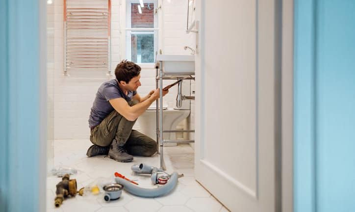 man repairing sink FHYp.width .jpg